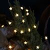 Lights4fun 50er LED Micro Lichterkette außen Sterne aus Gummi warmweiß